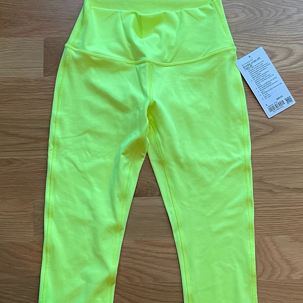 NWT Lululemon Wunder Under Size 8. 28” inseam. Small stain, not tried to wash.